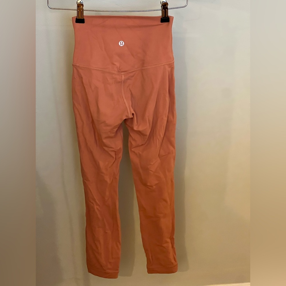 Size 0, Lululemon yoga pants, pale pink, barely worn.